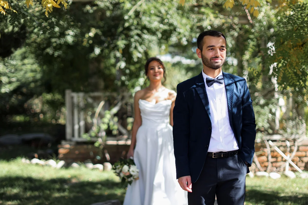 Bride and groom in a sunny outdoor setting, perfect for wedding bliss.